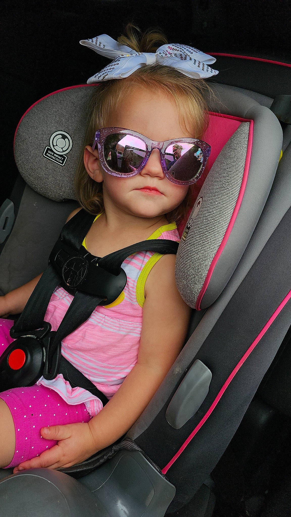 Kyrie joined the competition — help win amazing prizes! automotive_design, automotive_exterior, car, car_seat, car_seat_cover, child, comfort, cool, eyewear, facial_expression, fun, glasses, goggles, mouth, person, pink, steering_wheel, sunglasses, toddler, vehicle_door