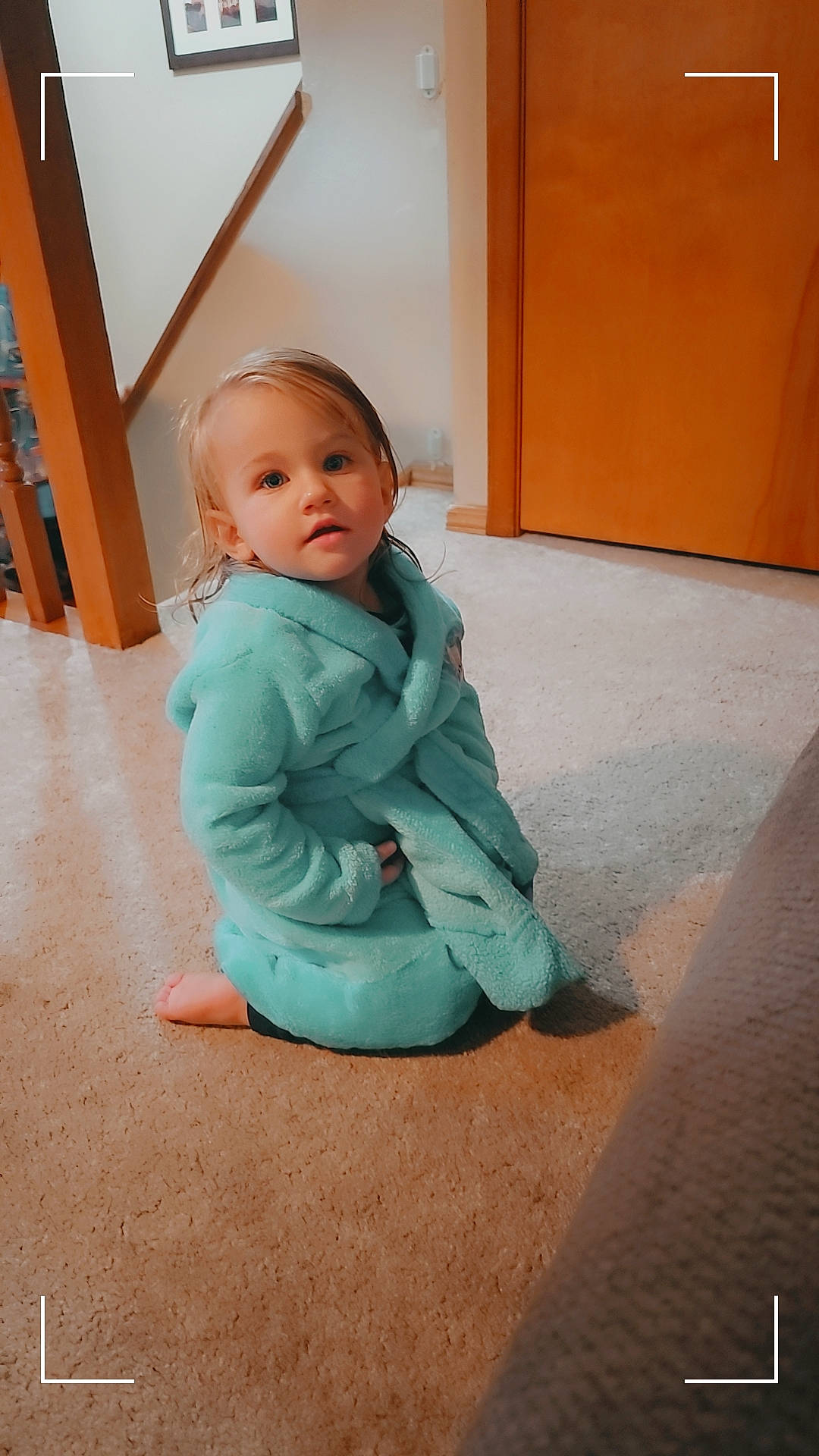 Kyrie joined the competition — help win amazing prizes! baby, baby_toddler_clothing, child, comfort, crawling, door, flooring, foot, fun, hardwood, human_leg, knee, person, room, sitting, sleeve, stairs, toddler, wood