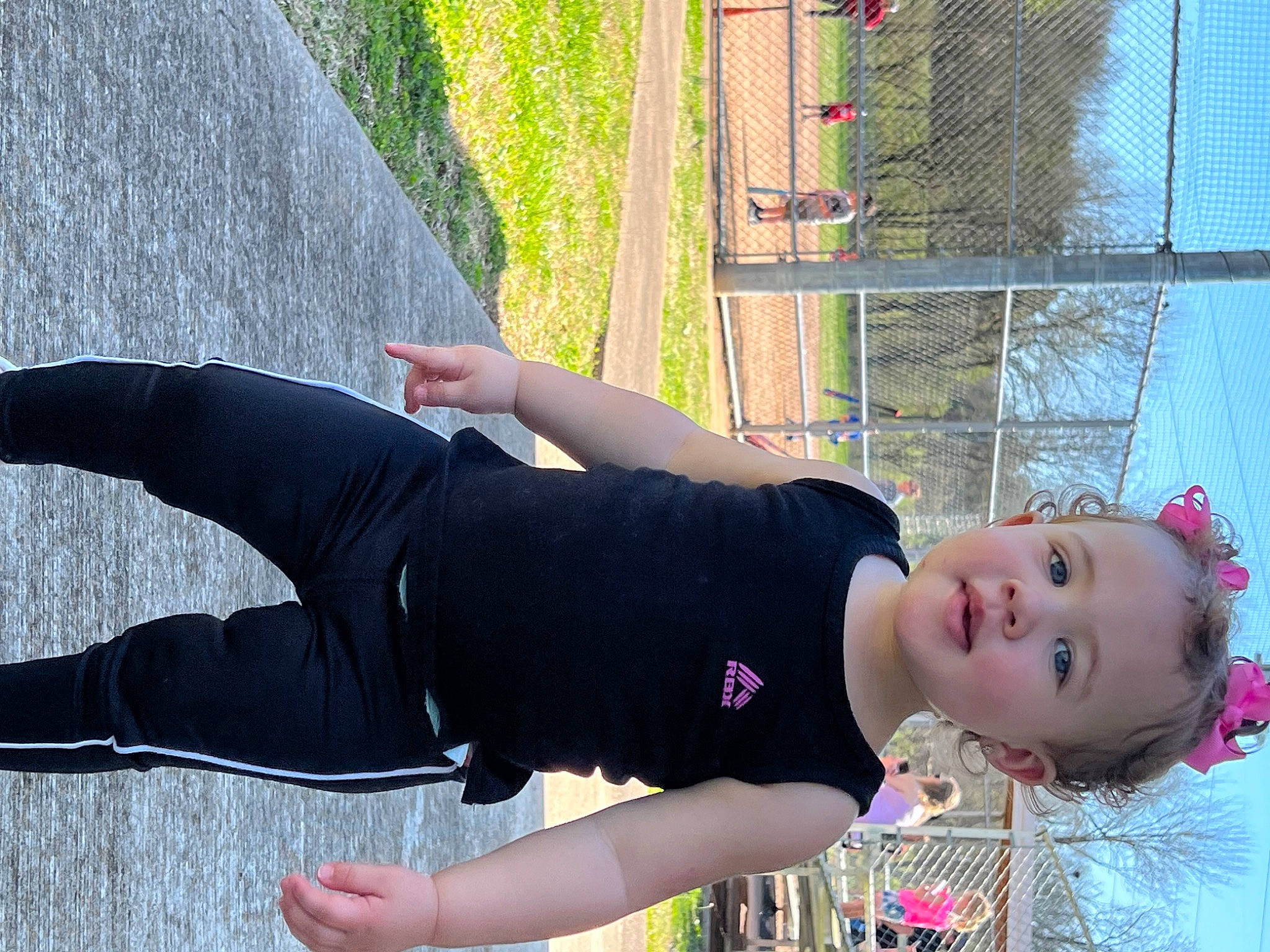 Aleena is registered to the contest to win money with this photo: active_pants, balance, black_hair, elbow, fashion, fun, grass, happy, human_leg, joint, knee, leggings, leisure, person, plant, sitting, sportswear, t_shirt, thigh, tree