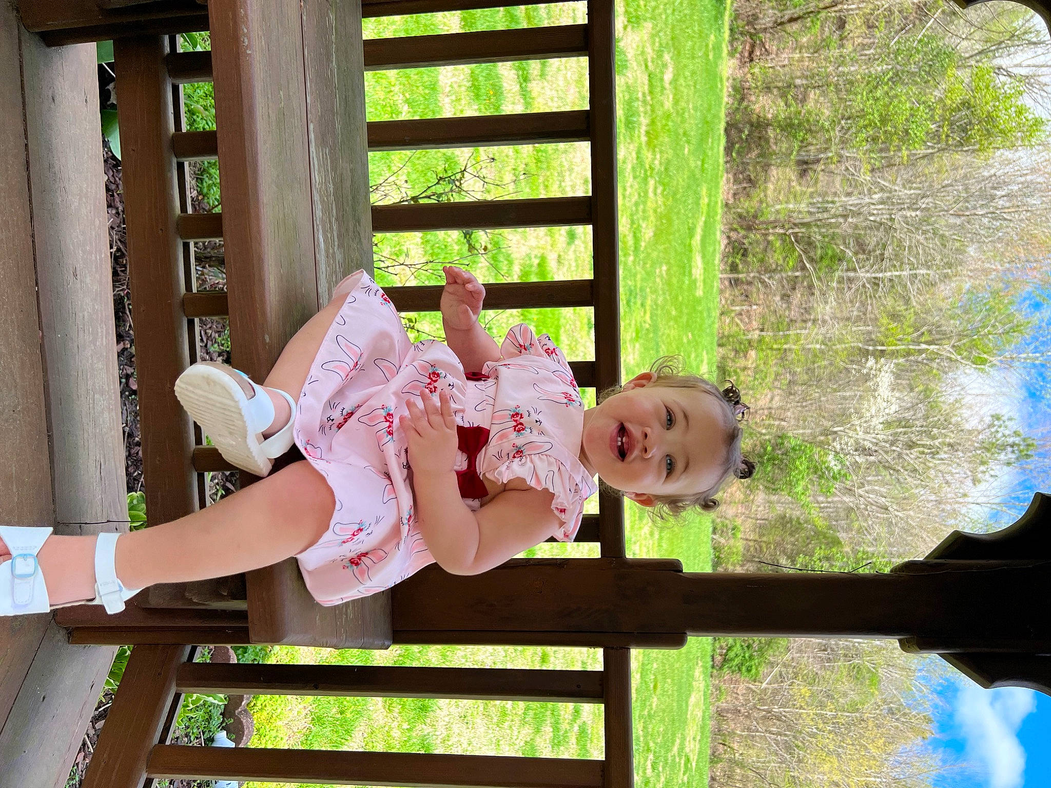 Aleena is registered to the contest to win money with this photo: baby, baby_toddler_clothing, child, fun, grass, green, happy, hat, human_leg, leisure, people_in_nature, person, plant, recreation, sitting, smile, thigh, toddler, tree, vacation