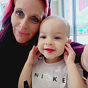 Jayziah joined the competition — help win amazing prizes! toddler, child, woman, smile, selfie, indoor, window, daylight, red_hair, casual_clothing, nike_shirt, portrait, happy, playful, face, person, light, restaurant, stop_sign, glass