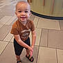 Jayziah is registered to the contest to win money with this photo: toddler, child, indoor, floor, tile, clothing, tshirt, shorts, sandals, smile, happy, person, young, boy, standing, hands, casual, carhartt, footwear, blur