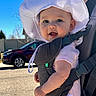 Harper joined the competition — help win amazing prizes! adult_partial, baby, baby_carrier, blue_sky, candid, car, cheeks, child, closeup, eyes, hat_brim, infant, outdoors, parent, portrait, sidewalk, smile, straps, sun_hat, sunny