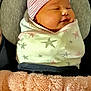 Harper joined the competition — help win amazing prizes! baby, sleeping, blanket, hat, striped, star_pattern, cushion, soft, cozy, infant, wrapped, pink, peach, headwear, child, indoors, portrait, resting, closeup, comfort