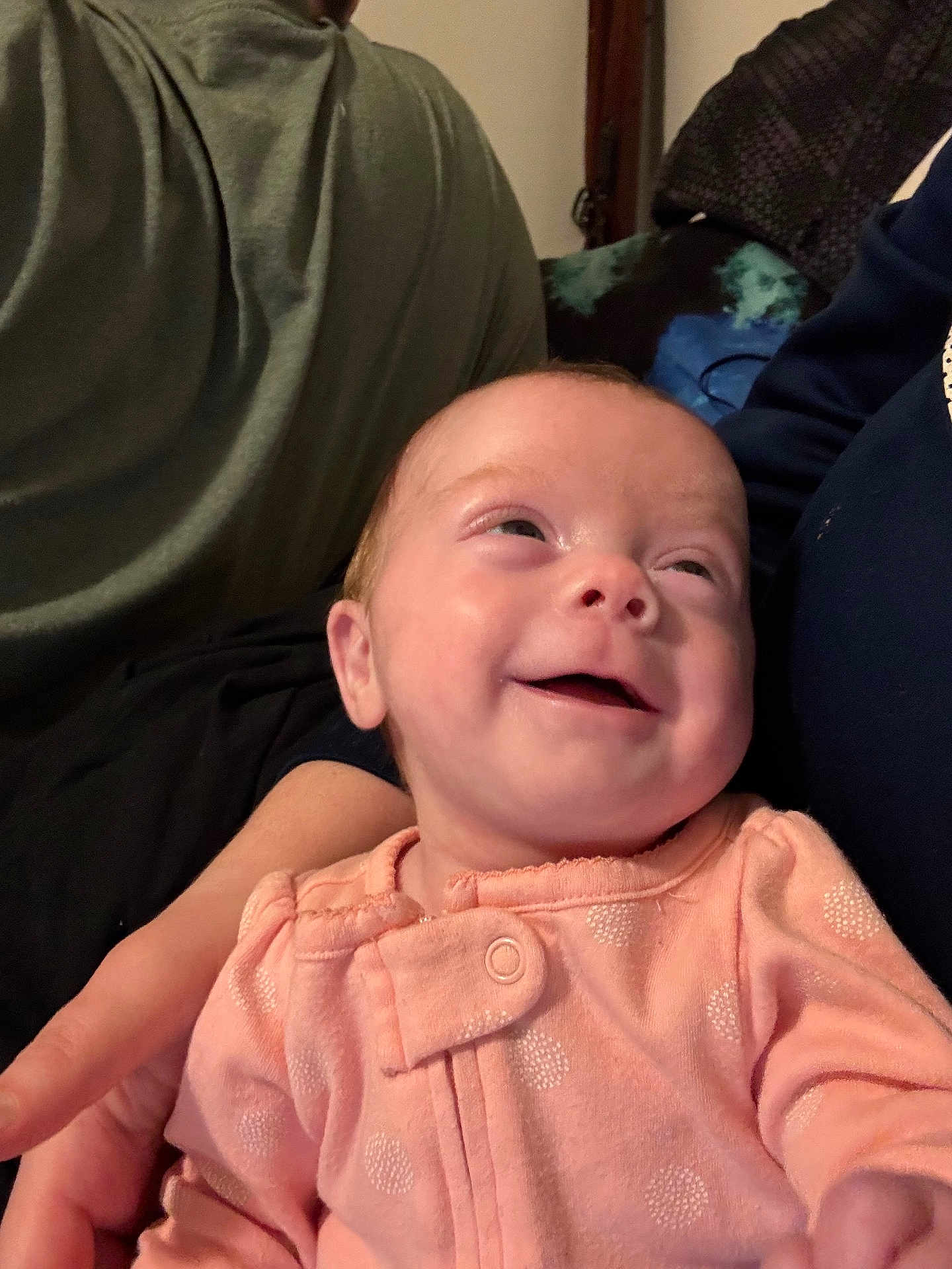 Adalynn joined the competition — help win amazing prizes! baby, infant, smile, happy, clothing, peach, polka_dot, person, hand, indoor, cozy, portrait, cute, child, face, newborn, sitting, warm, family, comfort