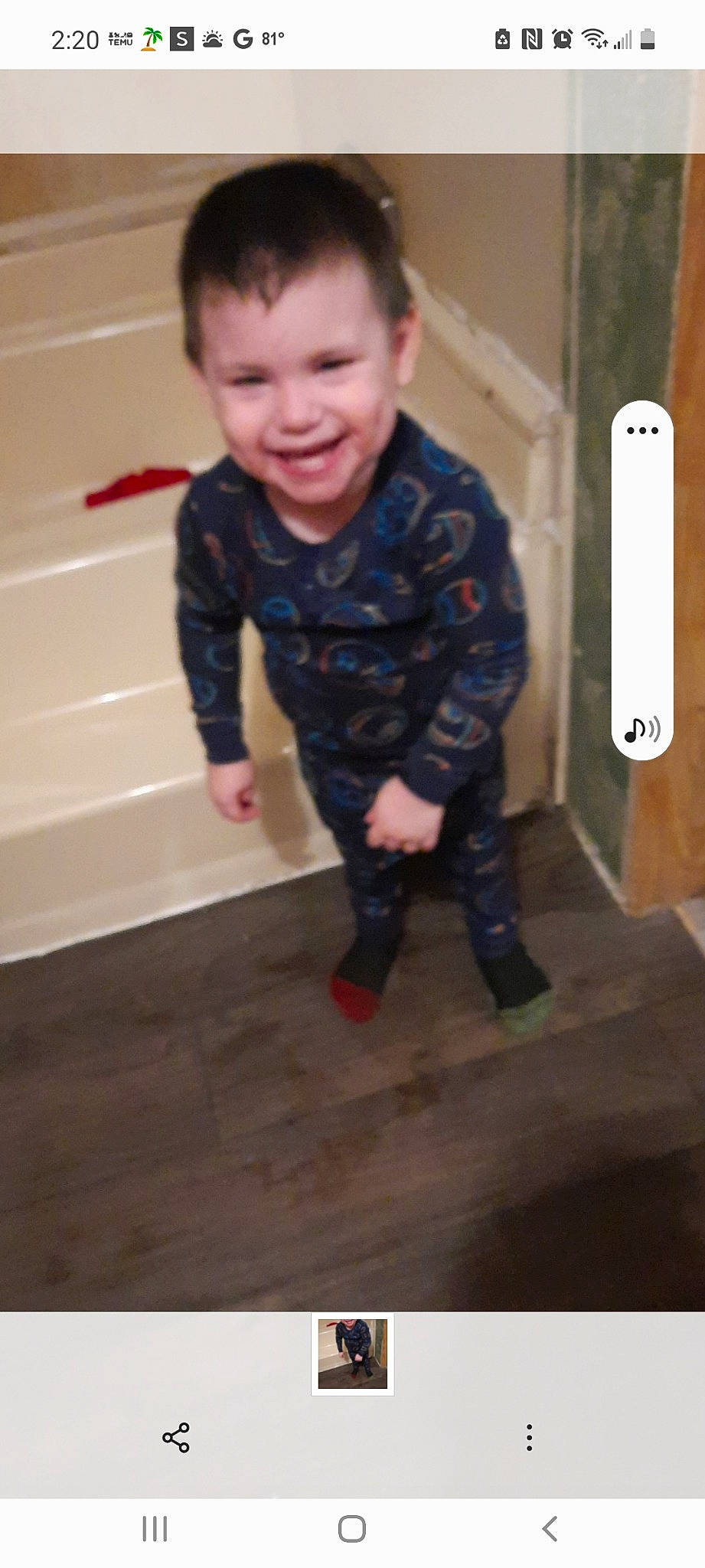 Christian is registered to the contest to win money with this photo: baby, baby_toddler_clothing, child, floor, flooring, fun, hair, happy, hardwood, joy, long_sleeved_t_shirt, pattern, person, play, room, sitting, sleeve, smile, standing, t_shirt