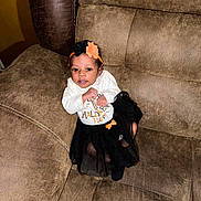 Jermany joined the competition — help win amazing prizes! baby, black, child, clothing, couch, cute, furniture, halloween, happy, headband, holiday, indoors, infant, orange, person, sitting, skirt, smile, tutu, white