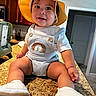 baby, child, infant, smiling, happy, portrait, sun_hat, overalls, rainbow, shoes, kitchen, countertop, indoors, sitting, fashion, cute, face, person, home, photography