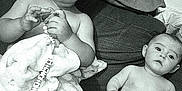 Shelby participe au concours pour gagner de l'argent avec cette photo : baby, babies, blanket, beads, clip, couch, diaper, face, infant, monochrome, person, portrait, relaxing, sitting, soft_texture, toddler, two_children, young, indoor, curious