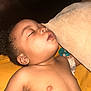 Naomi joined the competition — help win amazing prizes! child, toddler, sleeping, pacifier, pillow, yellow_blanket, bare_chest, closeup, indoor, peaceful, nap, relaxation, infant, skin, face, ear, mouth, hair, baby, resting