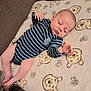 baby, bear_faces, bees, blanket, child, cozy, cute, hand, human, indoor, infant, legs, newborn, pajamas, peaceful, person, resting, sleeping, soft_texture, striped_clothing