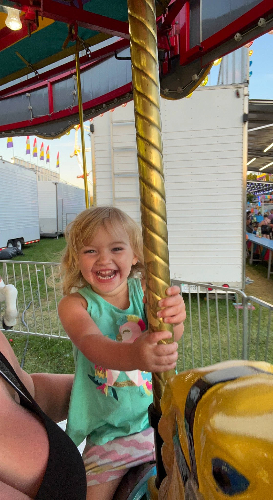 Braylee is registered to the contest to win money with this photo: amusement_ride, chair, child, city, community, event, fun, happy, human_settlement, joy, leisure, people, person, playground, pole, public_space, recreation, smile, snapshot, summer