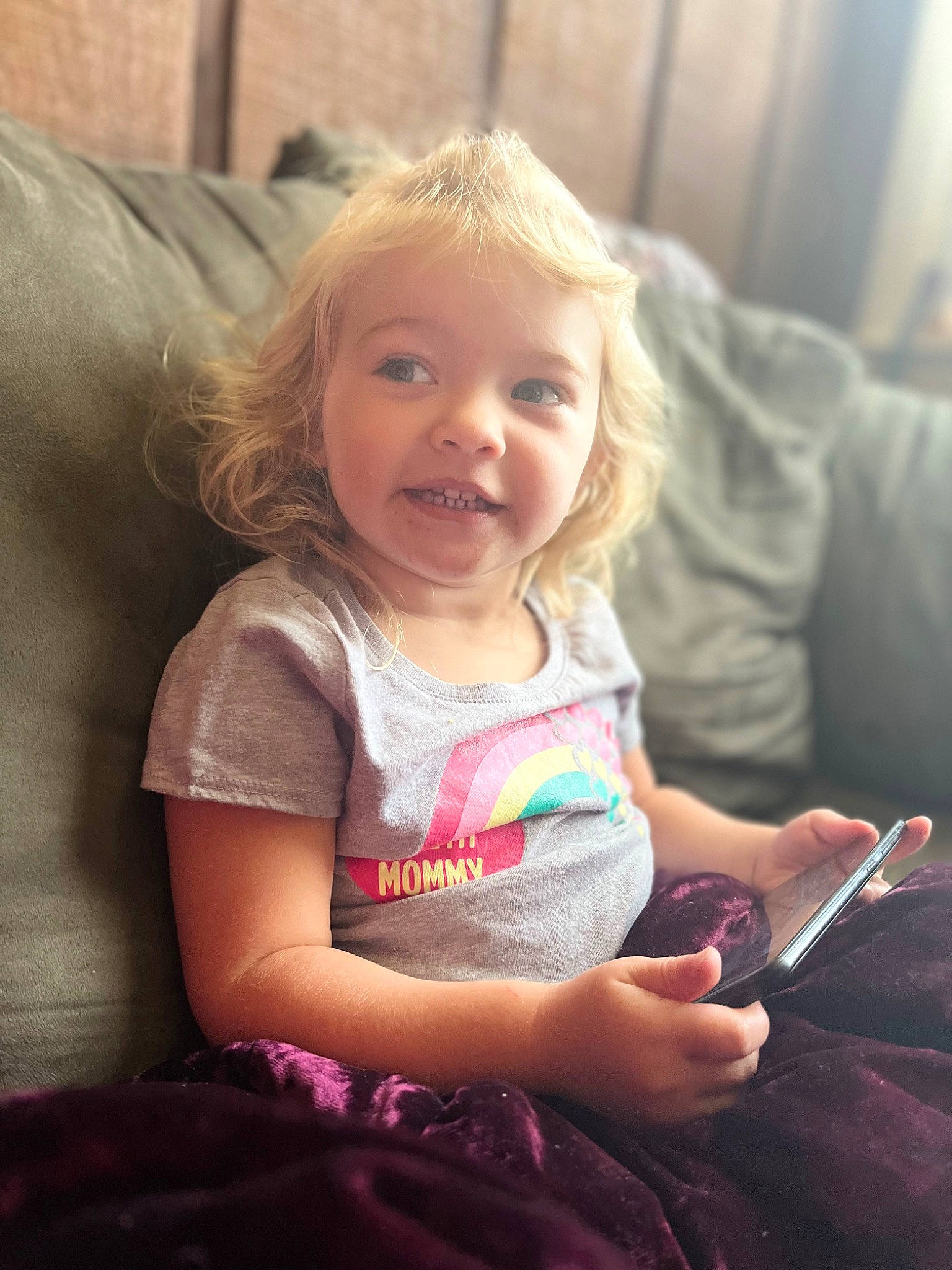 Braylee joined the competition — help win amazing prizes! blond, cheek, child, comfort, communication_device, finger, fun, hair, happy, iris, lap, long_hair, mobile_phone, person, pink, portable_communications_device, sitting, skin, smile, standing