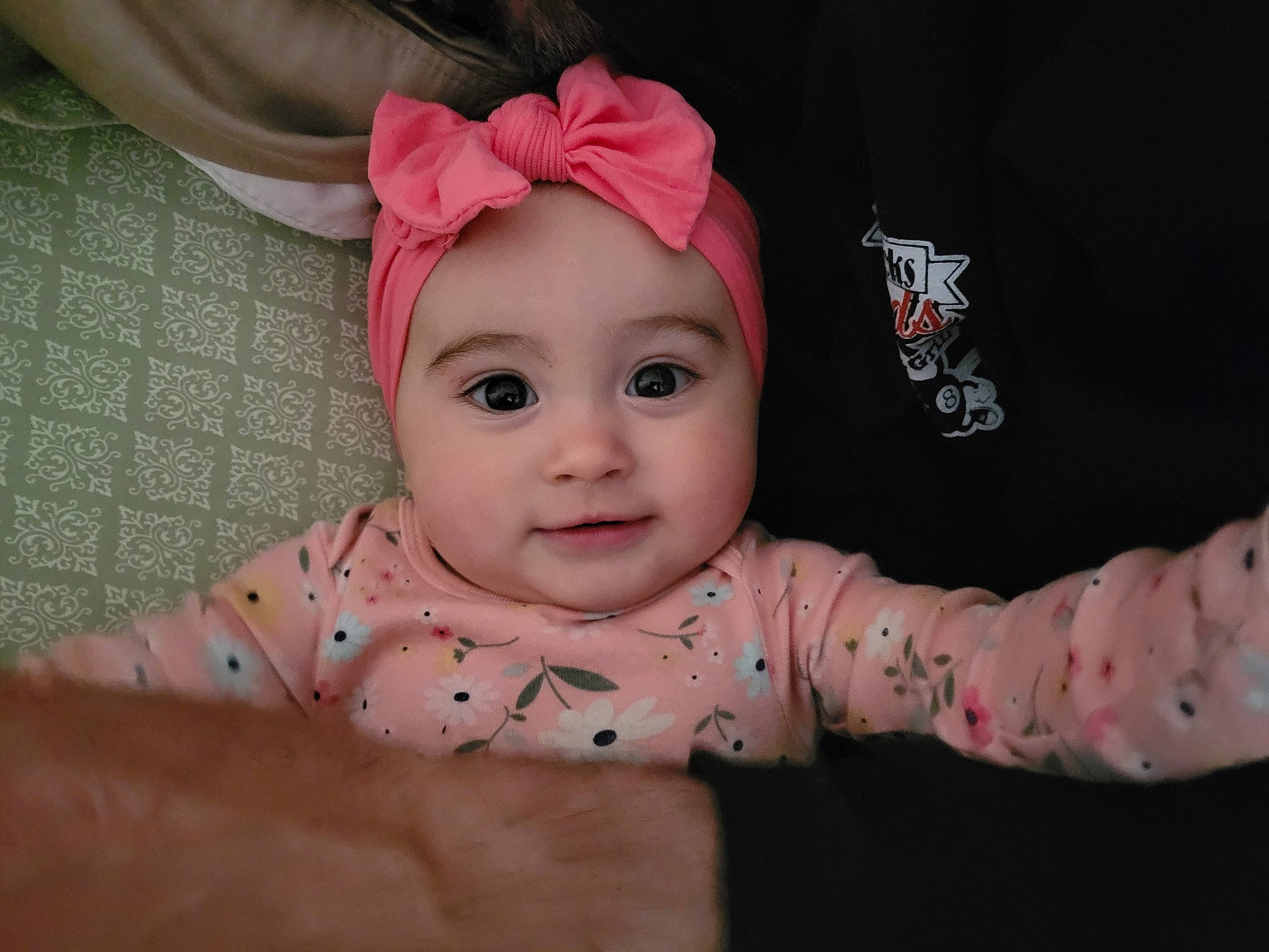 Taylor is registered to the contest to win money with this photo: baby, baby_toddler_clothing, cheek, ear, eye, eyebrow, eyelash, face, flash_photography, flooring, happy, head, headwear, human_body, lip, nose, person, pink, skin, sleeve