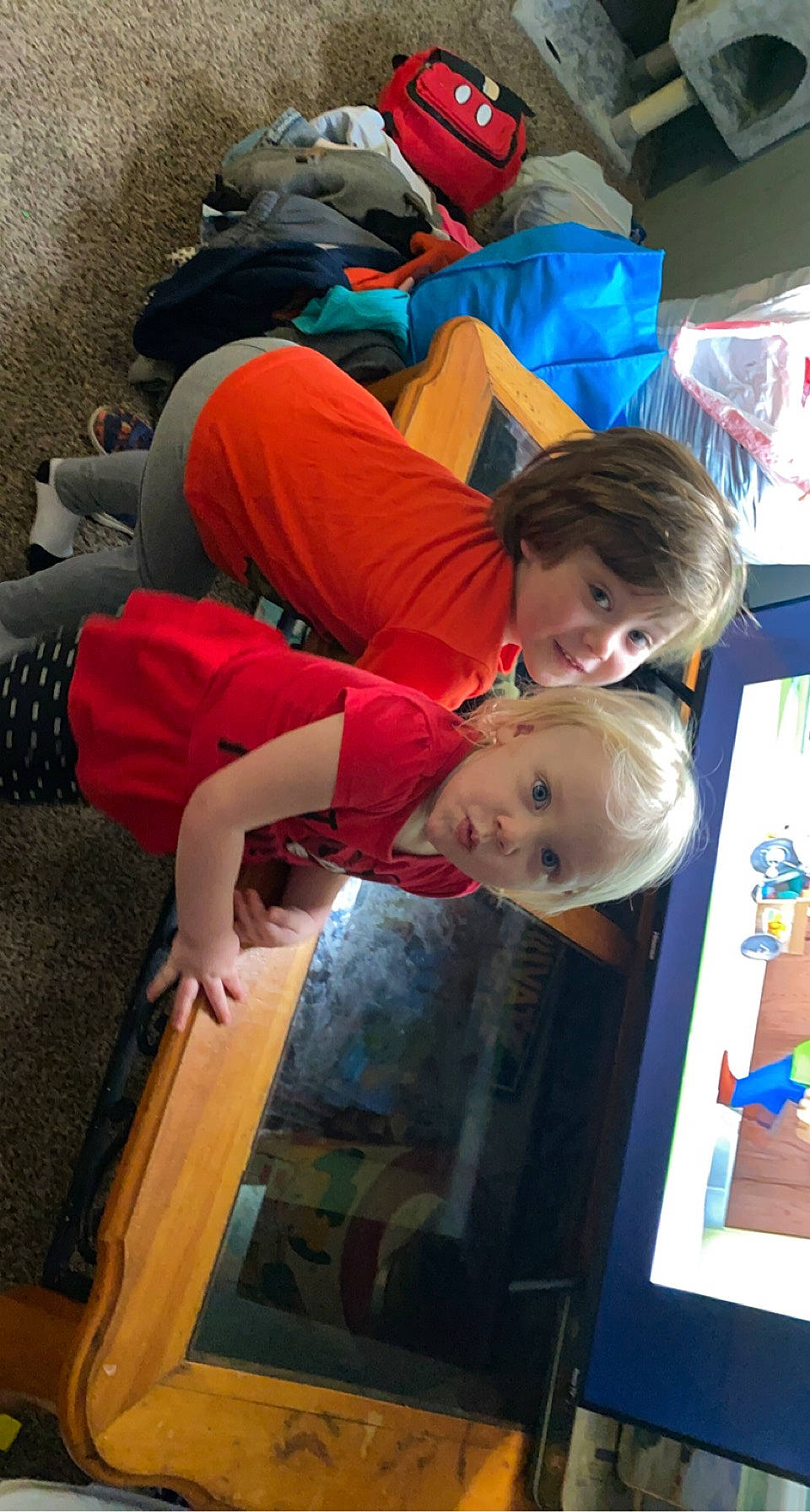 Annie is registered to the contest to win money with this photo: baby, child, comfort, flooring, fun, happy, human, human_leg, leisure, orange, person, play, red, room, t_shirt, toddler, tree, vacation, visual_arts, wood