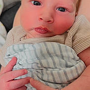 Gregory is registered to the contest to win money with this photo: baby, newborn, infant, face, hands, blanket, striped, skin, cute, closeup, person, young, child, soft, expression, human, portrait, sleepwear, wrapped, newborn_baby