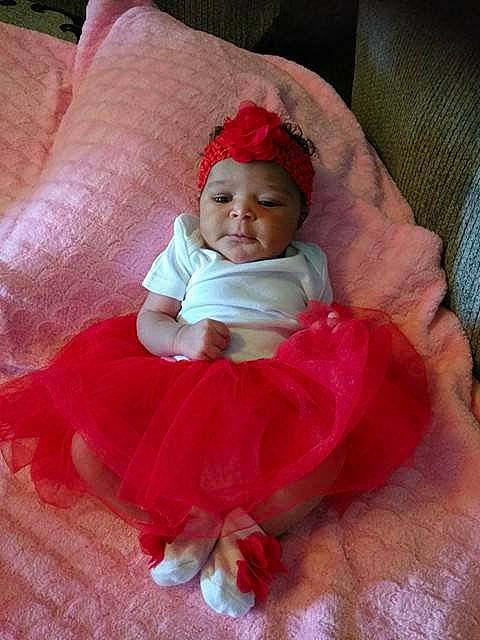 Ny'Asia is registered to the contest to win money with this photo: baby, baby_products, cheek, child, hand, headgear, lip, peach, person, pink, plant, product, red, skin, smile, toddler