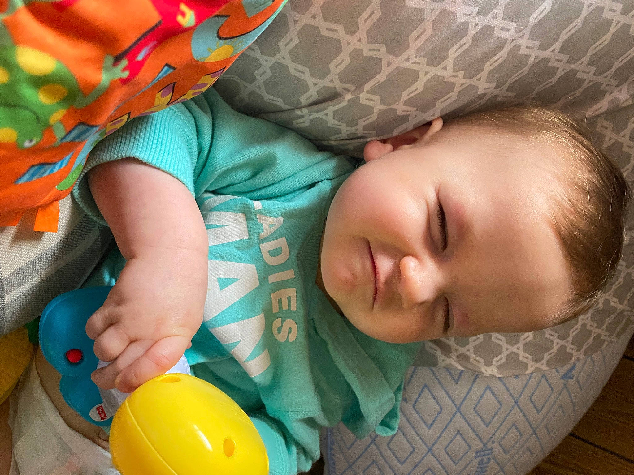 Jaxson is registered to the contest to win money with this photo: baby, baby_products, baby_sleeping, baby_toddler_clothing, beauty, cheek, child, comfort, facial_expression, green, linens, pattern, person, product, room, sitting, skin, sleeve, textile, toddler
