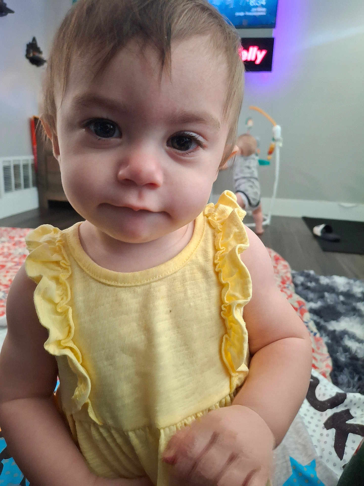 Ainsley is registered to the contest to win money with this photo: toddler, child, yellow_dress, curious, indoor, baby, person, face, expression, cute, home, floor, toy, background, play, infant, clothing, closeup, portrait, young_child