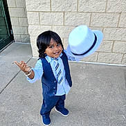 Atharv joined the competition — help win amazing prizes! blue_suit, boy, bracelet, brick_wall, casual, child, concrete, fashion, formal_wear, happy, hat, outdoor, person, playful, portrait, smile, standing, suit, tie, white_hat