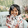 Atharv joined the competition — help win amazing prizes! black_hair, bow_tie, boy, child, colorful, cute, decor, fashion, flowers, formal_wear, happy, indoor, person, portrait, seated, smiling, suit_jacket, well_dressed, wicker_chair, young