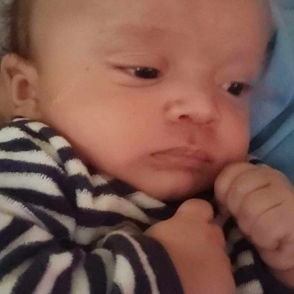 Cole is registered to the contest to win money with this photo: baby, baby_toddler_clothing, cheek, chin, comfort, ear, eye, eyebrow, eyelash, forehead, gesture, human_body, iris, lip, mouth, nose, skin, sleeve, thumb, toddler