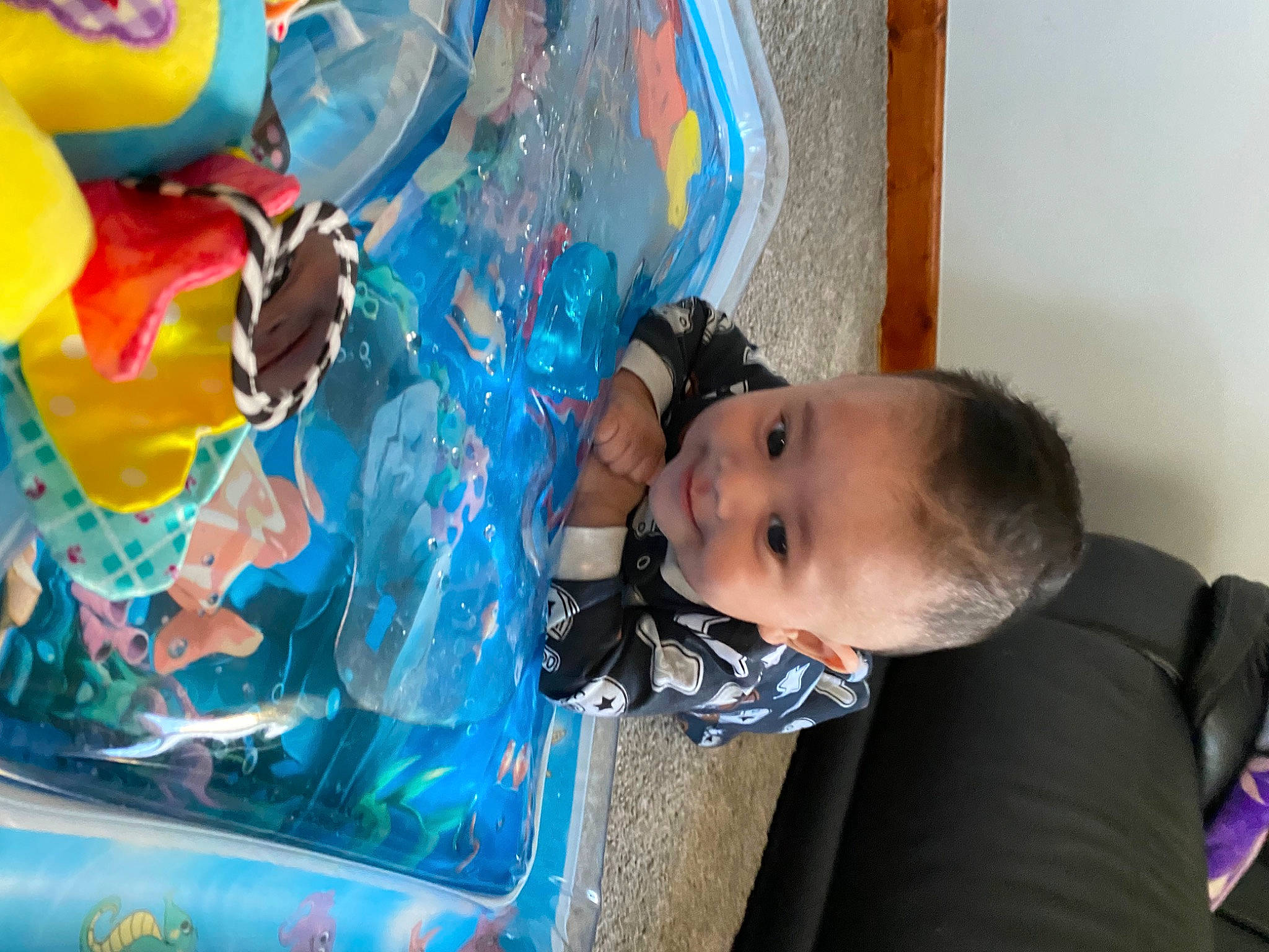 Nathan is registered to the contest to win money with this photo: azure, baby, baby_toddler_clothing, child, electric_blue, fluid, fun, happy, leisure, liquid, paint, party_supply, person, plastic, play, recreation, toddler, toy, vacation, visual_arts