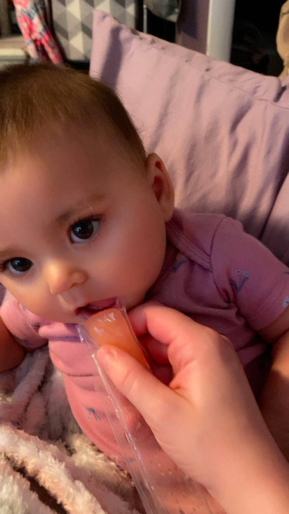 Blakeleigh is registered to the contest to win money with this photo: baby, baby_grabbing_for_something, cheek, chin, dress, ear, eyebrow, eyelash, finger, forehead, gesture, hand, iris, lip, mouth, neck, nose, person, skin, thumb