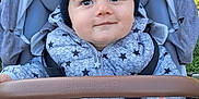 Sacha participe au concours pour gagner de l'argent avec cette photo : baby, child, clothing, cushion, cute, face, grass, hand, happy, hat, infant, jacket, knit_hat, outdoor, person, safety_harness, seat, smile, star_pattern, stroller