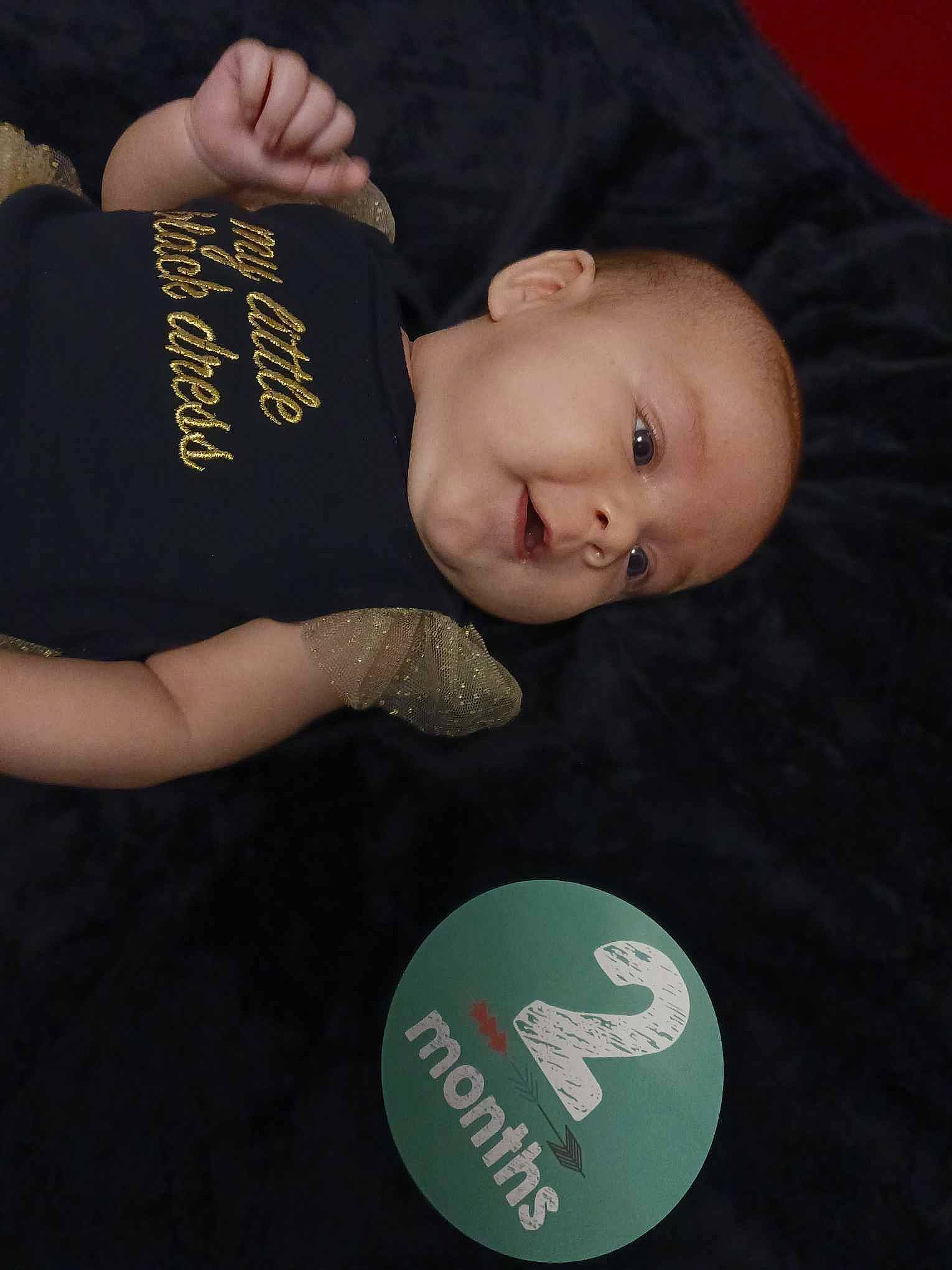 Aloy is registered to the contest to win money with this photo: baby, baby_products, baby_toddler_clothing, cheek, child, circle, comfort, cool, elbow, finger, flash_photography, font, knee, nail, person, sitting, sleeve, toddler, wood, wrist