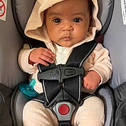 Kaileiah joined the competition — help win amazing prizes! baby, infant, child, car_seat, harness, hood, fuzzy_clothing, animal_ears, sitting, portrait, face, eyes, wide_eyed, pacifier, feet, indoors, vehicle, safety, pink_background, closeup