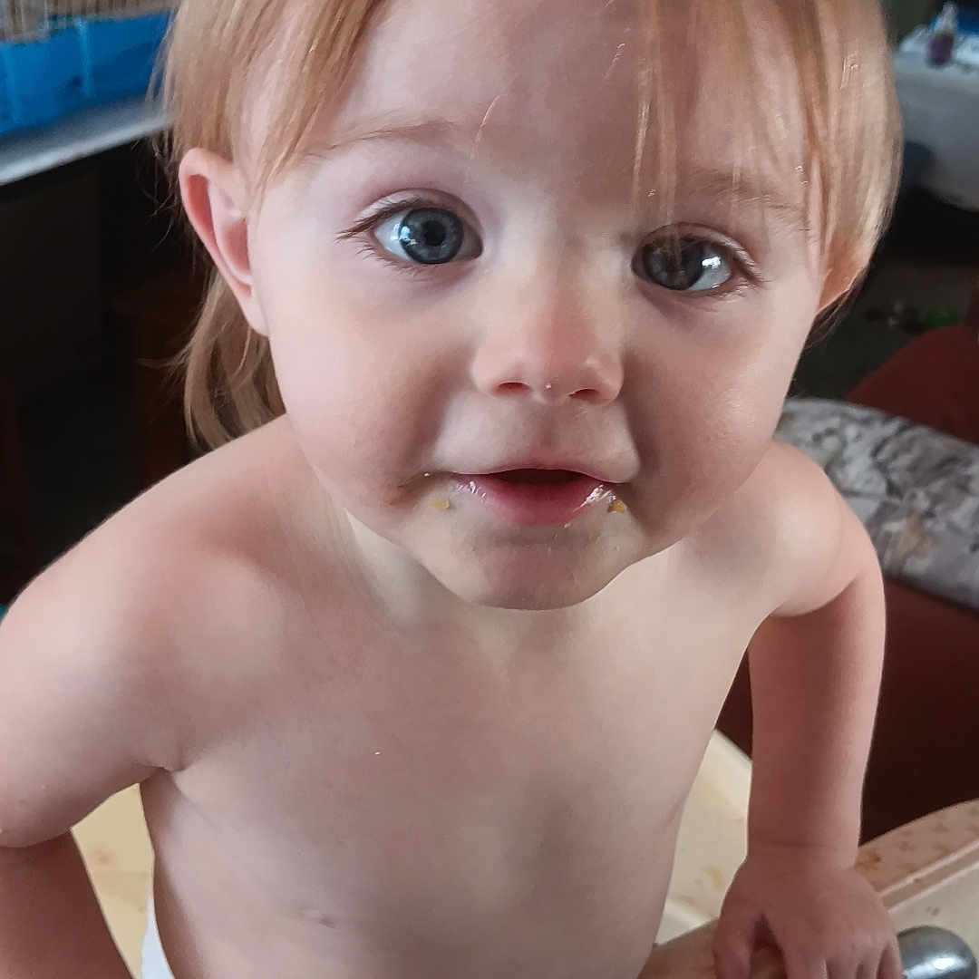 Alana is registered to the contest to win money with this photo: baby, bodypart, computerhardware, electronics, face, finger, frown, hand, hardware, head, monitor, person, photography, plywood, portrait, sad, screen, shelf, tv, wood