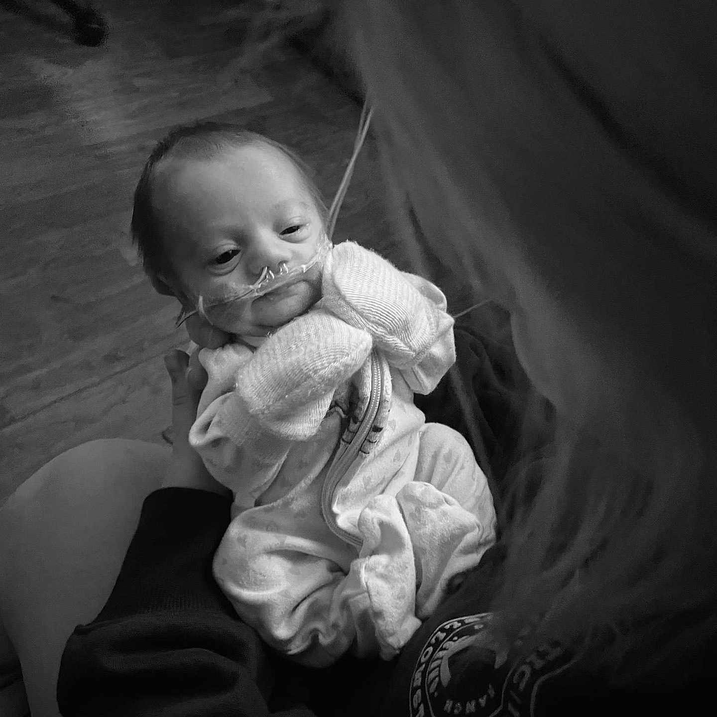 Emma is registered to the contest to win money with this photo: baby, blanket, bodypart, clothing, couch, face, finger, furniture, hand, happy, head, knitwear, newborn, person, photography, portrait, sitting, sleeping, smile, sweater