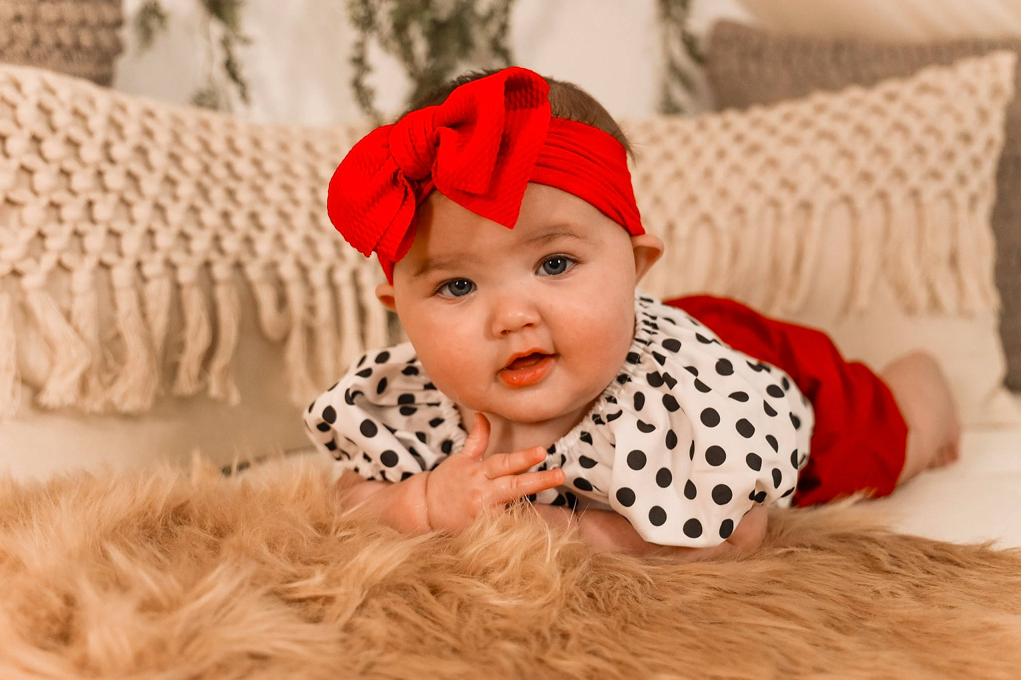 Arya joined the competition — help win amazing prizes! baby, baby_toddler_clothing, beanie, cap, child, comfort, costume_hat, couch, eye, flooring, fun, fur, happy, hat, headgear, headwear, linens, pattern, person, sleeve