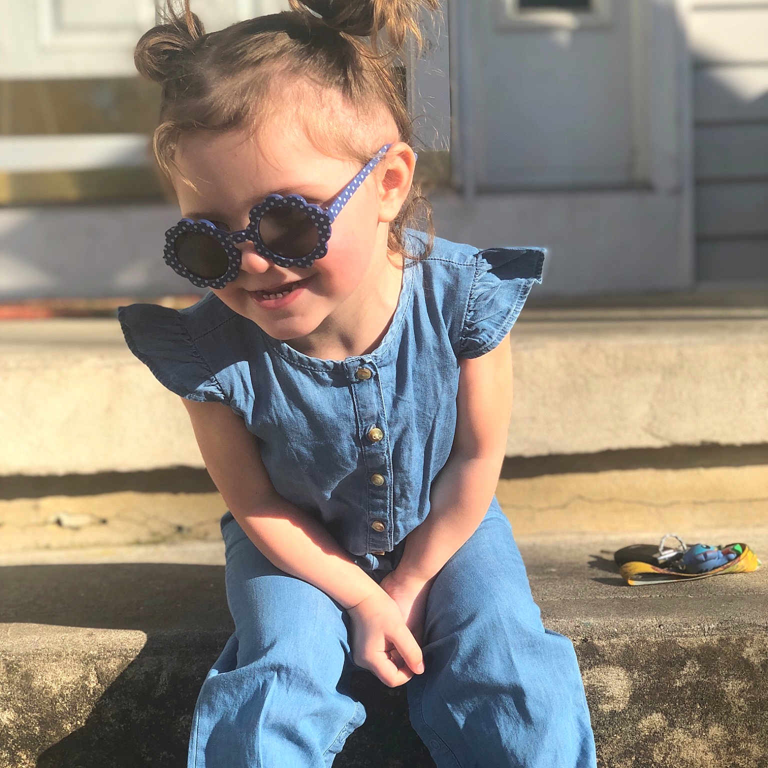 Elizabella is registered to the contest to win money with this photo: child, cool, denim, eyewear, fun, glasses, hairstyle, jeans, male, shoe, sitting, smile, sunglasses, t_shirt, textile, toddler, top, trousers, vacation, vision_care