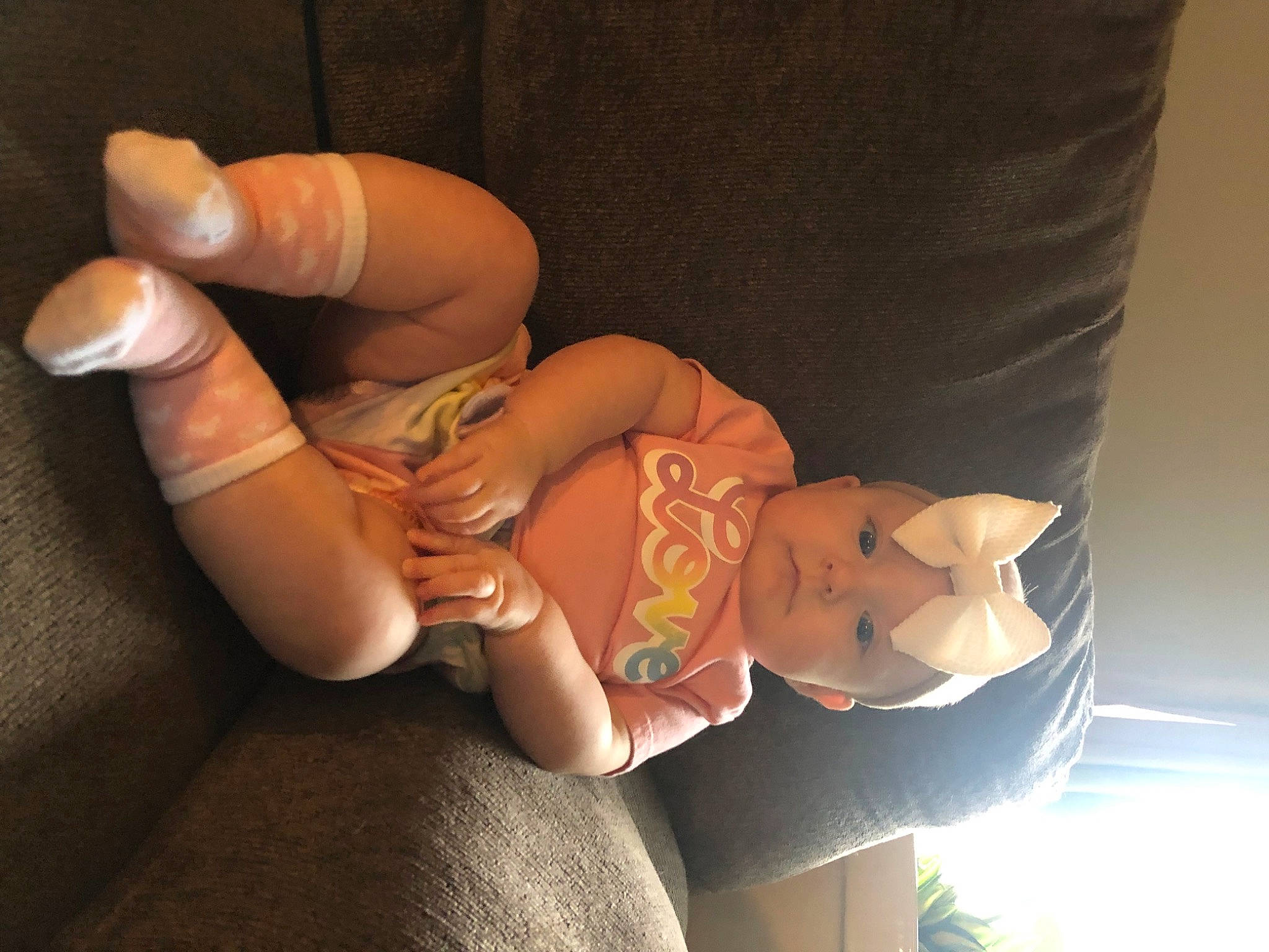 Phoenix is registered to the contest to win money with this photo: abdomen, baby, baby_toddler_clothing, comfort, eye, finger, foot, gesture, headwear, human_leg, joint, knee, lap, leg, nail, person, skin, thigh, thumb, toddler