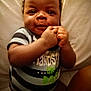 La'Treyveonn is registered to the contest to win money with this photo: baby, infant, smile, face, hands, clothing, striped_shirt, lying_down, cute, happy, child, portrait, skin, person, indoor, young, baby_girl, baby_boy, closeup, toddler