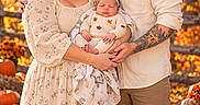 Keyleigh is registered to the contest to win money with this photo: autumn, baby, baby_clothing, child, fall, family, floral_dress, forest, infant, leaves, man, newborn, outdoor, parents, portrait, pumpkins, sleeping, smiling, tattoo, woman