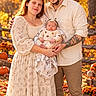 baby, child, infant, family, parents, portrait, outdoor, autumn, fall, pumpkins, leaves, forest, newborn, sleeping, smiling, man, woman, baby_clothing, floral_dress, tattoo