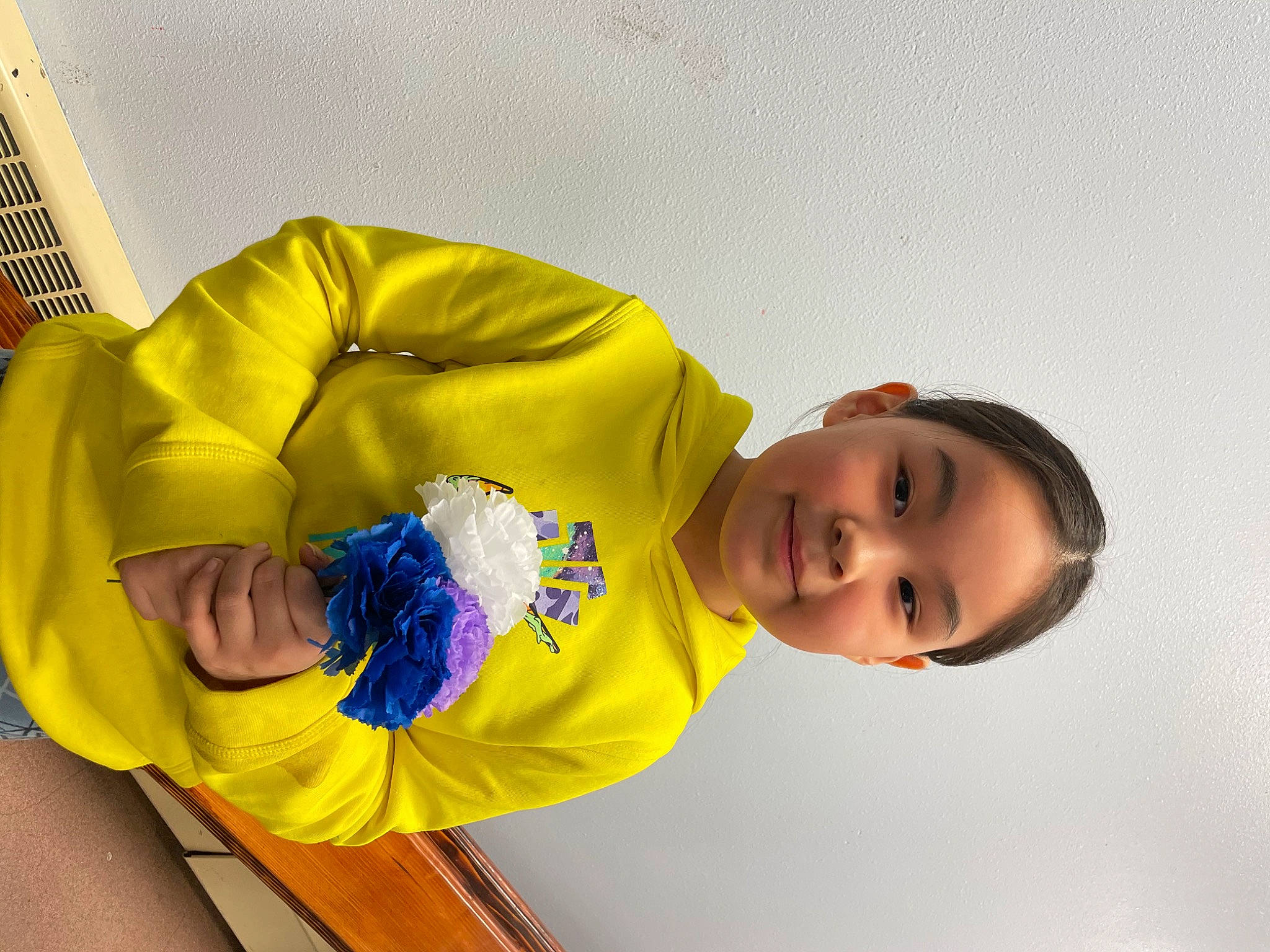 Priscilla joined the competition — help win amazing prizes! child, comfort, elbow, electric_blue, facial_expression, fun, happy, headgear, joy, leisure, person, personal_protective_equipment, play, room, sitting, sleeve, smile, sportswear, t_shirt, toddler