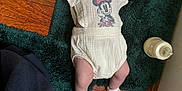 Sutton joined the competition — help win amazing prizes! baby, bodypart, bonnet, cap, clothing, couch, diaper, face, furniture, hardwood, hat, head, hosiery, newborn, person, photography, portrait, sitting, sock, wood