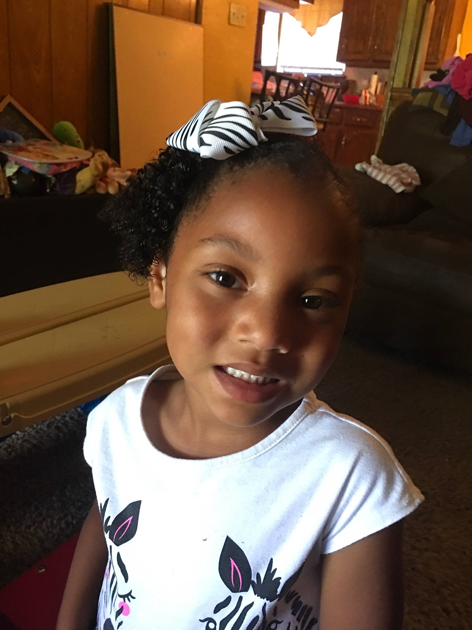 Kynleigh is registered to the contest to win money with this photo: black_hair, child, cool, ear, eyebrow, face, fashion_accessory, forehead, fun, hair, hair_accessory, hairstyle, head, headgear, joy, person, selfie, smile, toddler