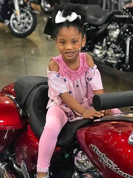 Kynleigh is registered to the contest to win money with this photo: auto_show, automotive_design, automotive_window_part, car, child, child_model, family_car, helmet, joy, leg, mid_size_car, motor_vehicle, motorcycle, person, photography, sitting, smile, vehicle, windshield