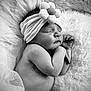 baby, newborn, sleeping, headband, flower, blanket, soft_texture, black_and_white, portrait, child, infant, peaceful, cute, skin, closeup, resting, tulle, hands, face, hair