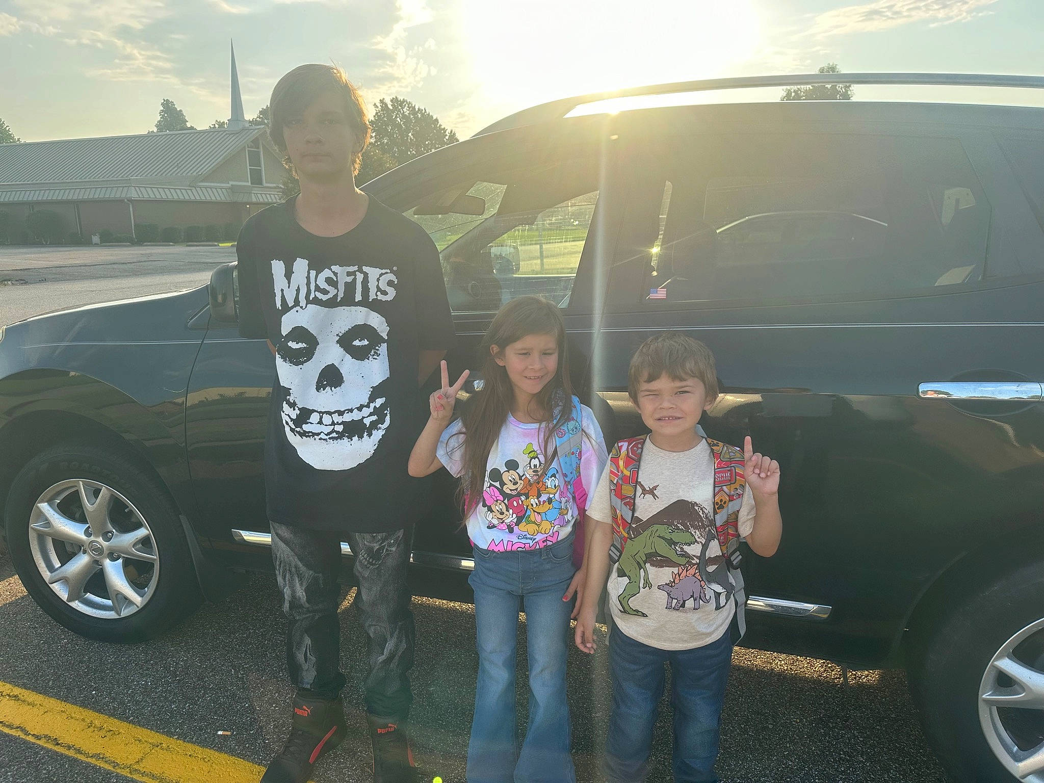 Jaxon is registered to the contest to win money with this photo: alloy_wheel, automotive_design, automotive_exterior, automotive_lighting, automotive_tire, bumper, car, cloud, cool, fender, hood, jeans, joy, motor_vehicle, parking, person, sky, smile, tire, vehicle