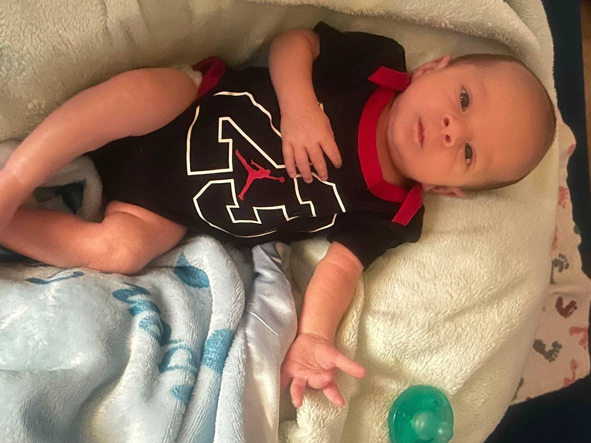 Jensen is registered to the contest to win money with this photo: arm, baby, baby_sleeping, baby_toddler_clothing, cheek, child, comfort, elbow, facial_expression, finger, human, mouth, organ, people, person, product, skin, sleeve, textile, thigh