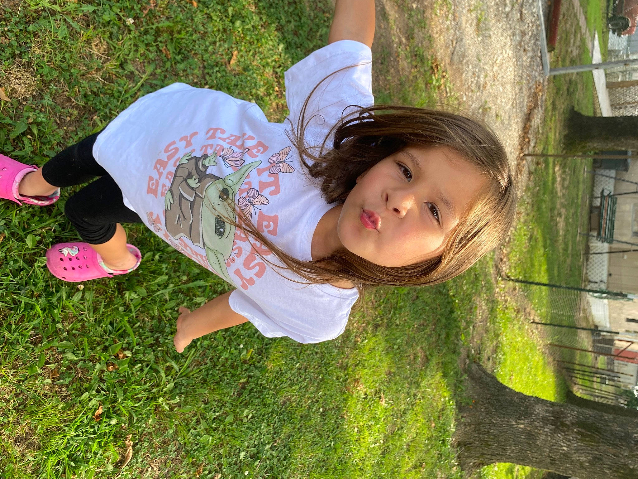 Jenna joined the competition — help win amazing prizes! botany, child, face, facial_expression, fun, grass, grass_family, happy, human_leg, knee, leisure, people_in_nature, person, petal, plant, sitting, t_shirt, thigh, toddler, tree