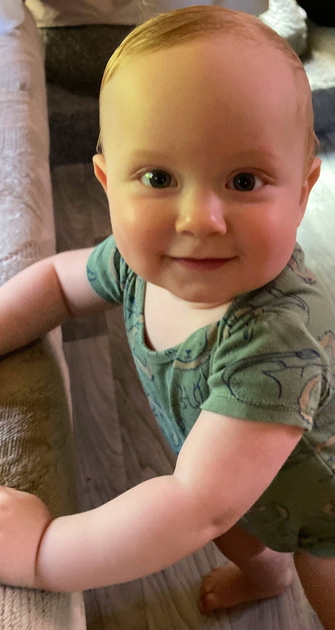 Jasper is registered to the contest to win money with this photo: baby_toddler_clothing, camouflage, cheek, chin, eye, facial_expression, finger, gesture, hairstyle, iris, joint, joy, mammal, military_camouflage, mouth, neck, nose, person, skin, sleeve