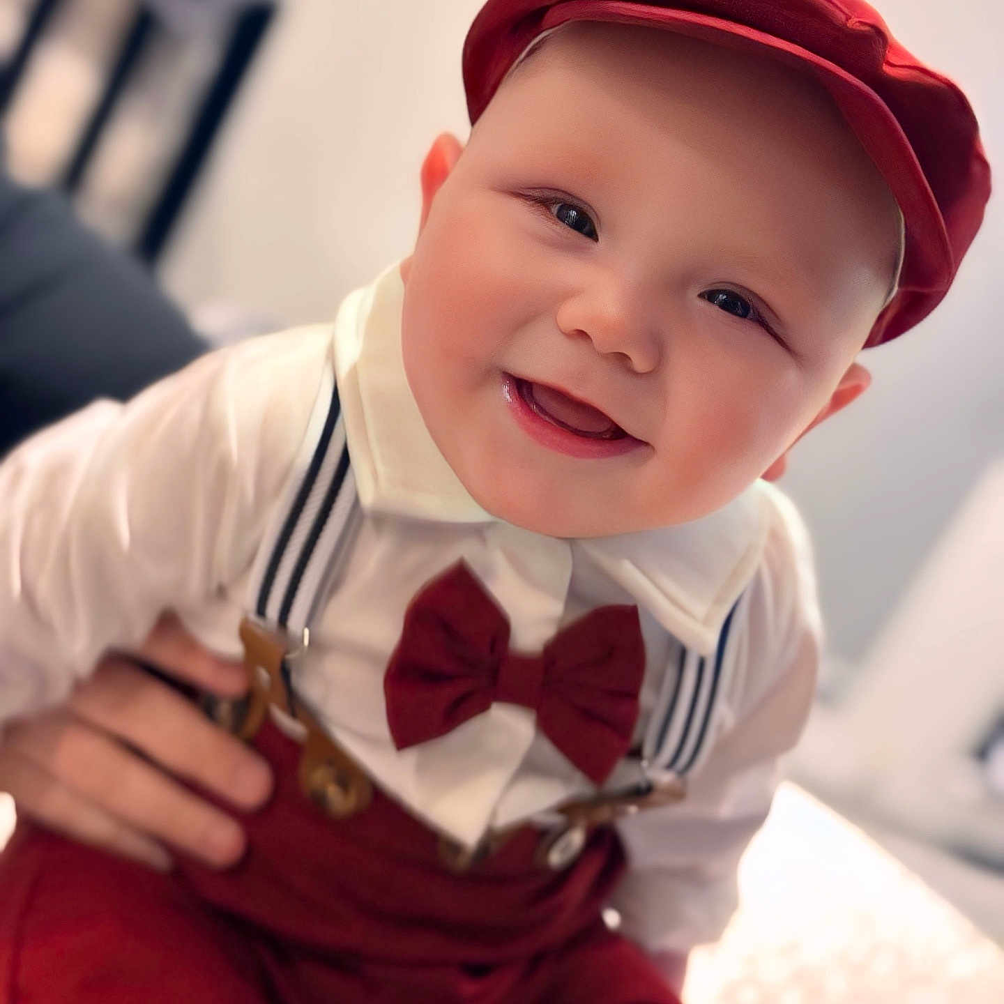 Giulian participe au concours pour gagner de l'argent avec cette photo : accessories, baby, babylaughing, bodypart, bowtie, clothing, dress, face, finger, formalwear, hand, happy, hat, head, person, photography, portrait, shirt, smile, tie