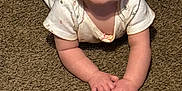 Winter is registered to the contest to win money with this photo: baby, carpet, child, crawling, cute, expression, face, hands, happy, head, indoor, infant, onesie, pattern, person, skin, smile, soft, texture, young